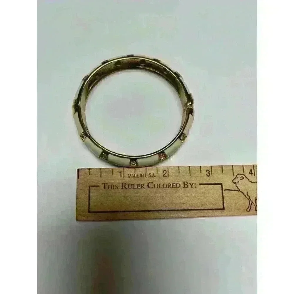 White enamel‎ bracelet with gold/rhinestone accents
